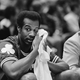 Washington sits on the bench during his first game after the punch. Photo credit: AP